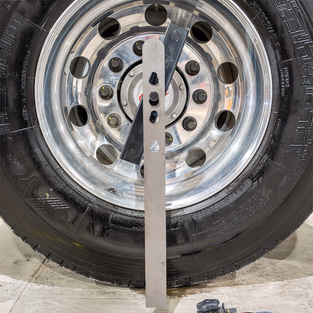 Axletrac Alignment Plumb Bar Attached to Wheel